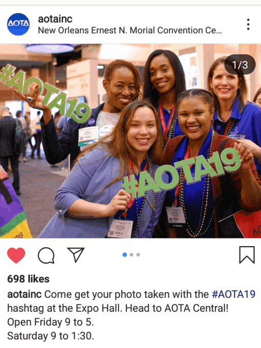 AOTA members hold up the hashtag sign at Conference